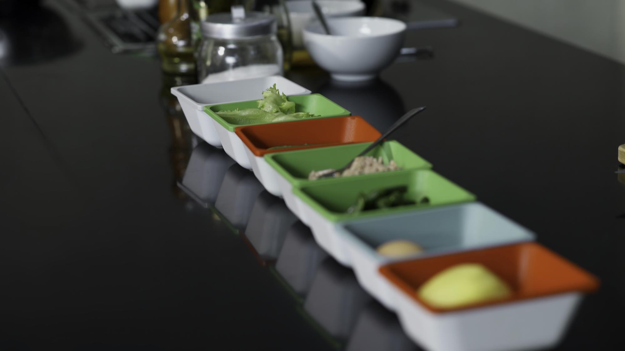 ingredients laid out in labeled trays for tasting kit